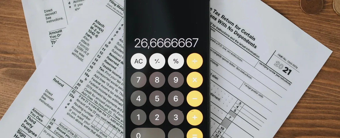 SMSF trustee reviewing superannuation documents with calculator showing $3 million threshold and Division 296 tax calculation on desk