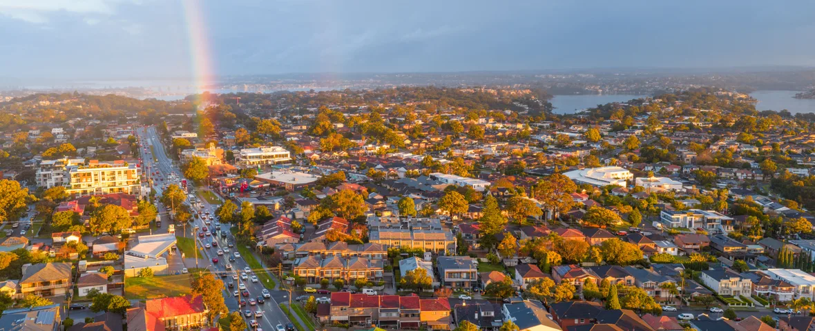 Aerial view of Sydney suburb rooftops representing NSW rental yield by postcode in 2026