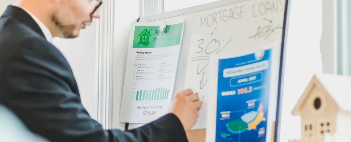 Stressed Australian mortgage holder reviewing loan documents and bank statements after RBA rate hike to 4.35 percent