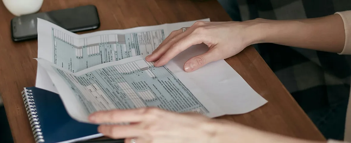 Australian professional reviewing a salary sacrifice superannuation statement and tax return at a desk in Sydney, 2025