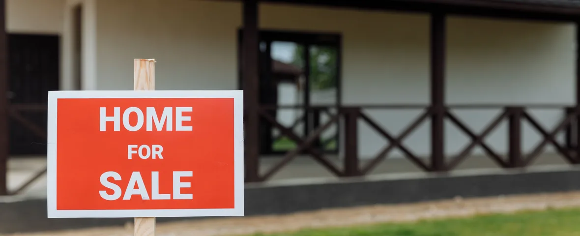 Australian investment property with a for-sale sign, the decision many owners are weighing before the 1 July 2027 CGT changes
